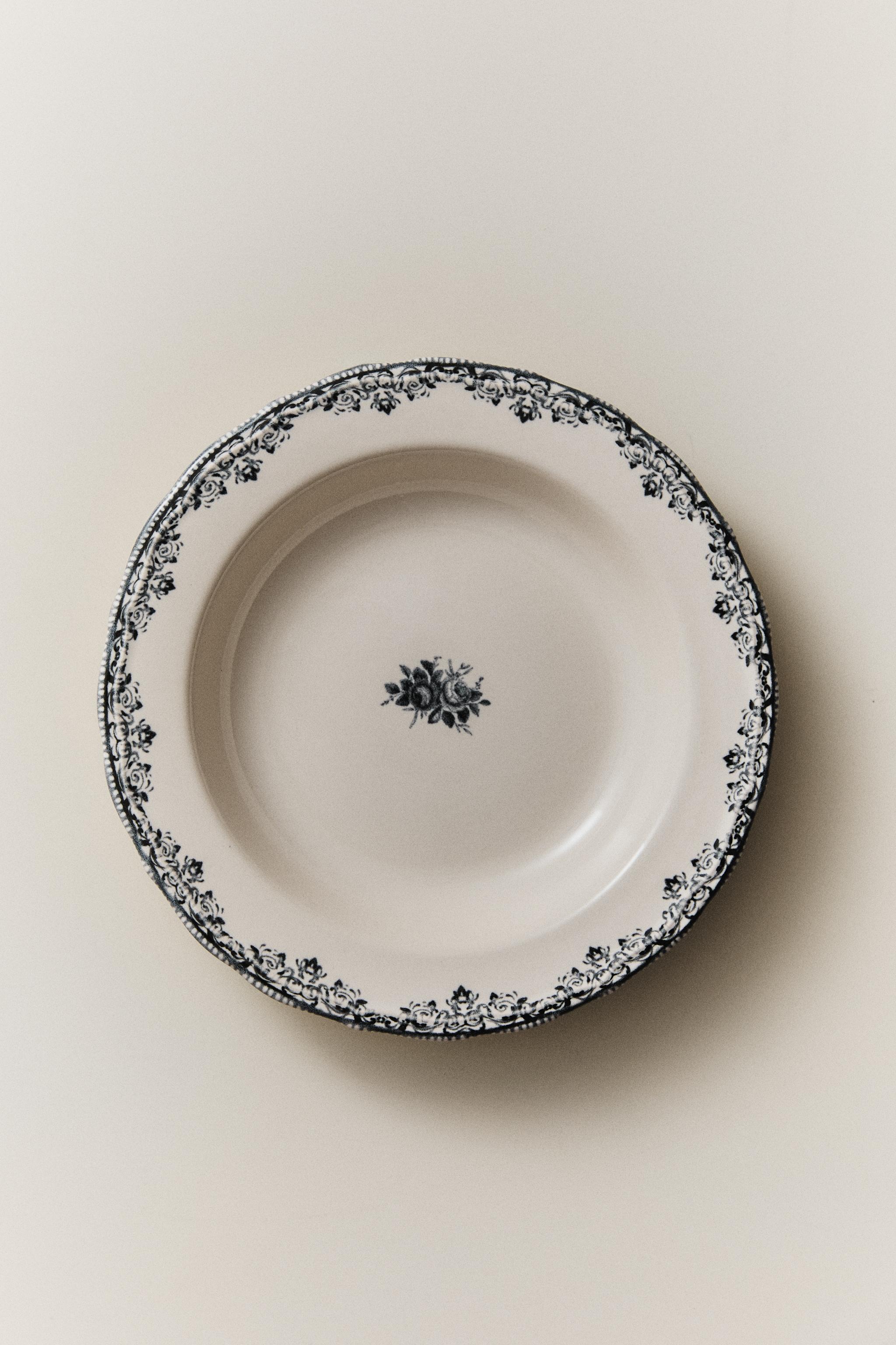 EARTHENWARE SOUP PLATE WITH PLACED DESIGN
